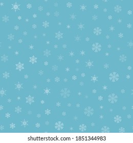 Snow seamless pattern. White snowflakes on blue background. Falling snow.