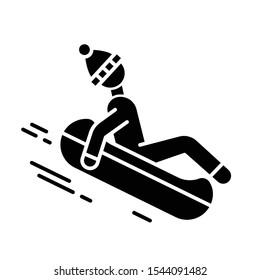 Snow tubing glyph icon. Winter extreme sport, risky activity and adventure. Cold season outdoor leisure for children and adults. Silhouette symbol. Negative space. Vector isolated illustration