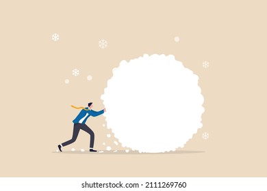 Snowball effect from small build up larger with potential risk, financial growth or mistake concept, businessman investor rolling large snowball build up from small getting bigger.
