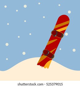 snowboard standing in snow