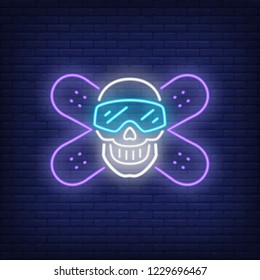 Snowboarding club neon sign. Crossed snowboarders and skull in goggles on brick background. Night bright advertisement. Vector illustration in neon style for sport, hobby, lifestyle