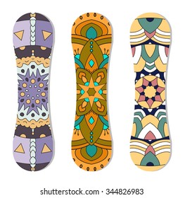 Snowboards with geometric color pattern on a white isolated background.