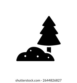 Snowdrift beside tree in winter forest landscape