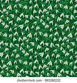 Snowdrops in the grass. Seamless floral pattern. Vector illustration.