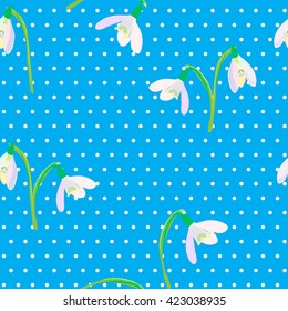 Snowdrops on a blue background. Spring vector illustration. Spring background. Seamless pattern with snowdrops. For packaging, prints on fabric, backgrounds, different card