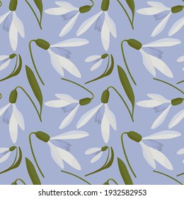 Snowdrops vector. Snowdrops in spring seamless vector pattern. Vector pattern snowdrops.Snowdrops on a blue background.