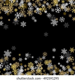 Snowfall background with golden snowflakes blurred in perspective
