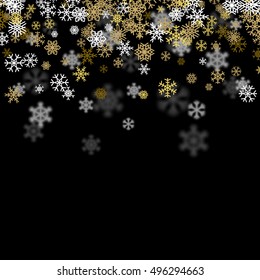 Snowfall background with golden snowflakes blurred in perspective