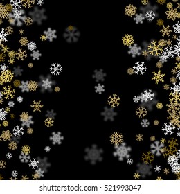 Snowfall background with golden snowflakes blurred in perspective
