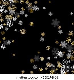 Snowfall background with golden snowflakes blurred in perspective