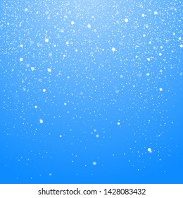 Snowfall isolated on blue background. Winter Christmas Background with Blue Sky. Falling Christmas Shining Beautiful Snow. Vector illustration