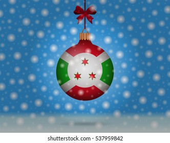 Snowfall and ornament with flag of Burundi