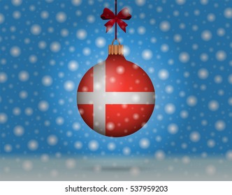 Snowfall and ornament with flag of Denmark