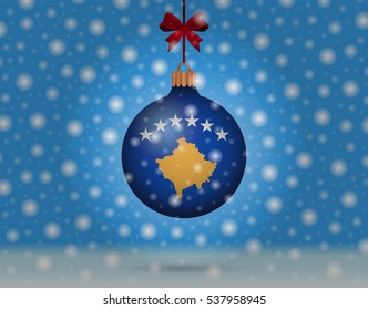 Snowfall and ornament with flag of Kosovo
