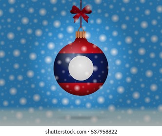 Snowfall and ornament with flag of Laos