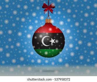 Snowfall and ornament with flag of Libya