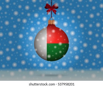 Snowfall and ornament with flag of Madagascar