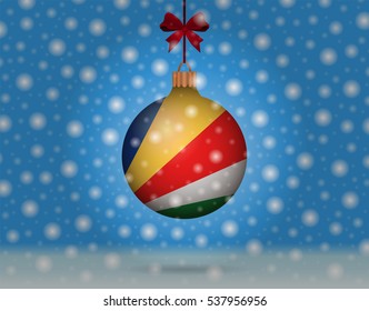 Snowfall and ornament with flag of seychelles