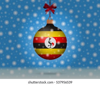 snowfall and ornament with flag of Uganda