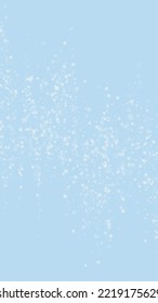 Snowfall overlay christmas background. Subtle flying snow flakes and stars on light blue winter backdrop. Festive snowfall overlay. Vertical vector illustration.