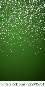 Snowfall overlay christmas background. Subtle flying snow flakes and stars on christmas green background. Festive snowfall overlay. Vertical vector illustration.