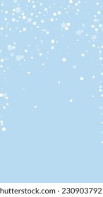 Snowfall overlay christmas background. Subtle flying snow flakes and stars on light blue winter backdrop. Festive snowfall overlay. Vertical vector illustration.
