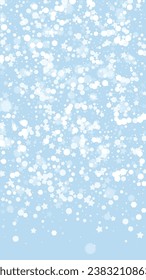 Snowfall overlay christmas background. Subtle flying snow flakes and stars on light blue winter backdrop. Festive snowfall overlay. Vertical vector illustration.