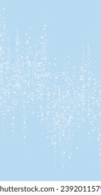 Snowfall overlay christmas background. Subtle flying snow flakes and stars on light blue winter backdrop. Festive snowfall overlay. Vertical vector illustration.