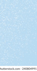 Snowfall overlay christmas background. Subtle flying snow flakes and stars on light blue winter backdrop. Festive snowfall overlay. Vertical vector illustration.