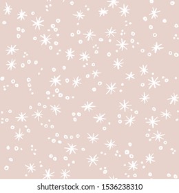 Snowfall with snowflakes on pastel background. Christmas and New Year seamless vector pattern