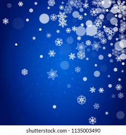 Snowflake border for Christmas and New Year celebration. Holiday snowflake border on blue background with sparkles. For banners, gift coupons, vouchers, ads, party events. Falling frosty snow.