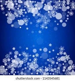 Snowflake border for Christmas and New Year celebration. Holiday snowflake border on blue background with sparkles. For banners, gift coupons, vouchers, ads, party events. Falling frosty snow.