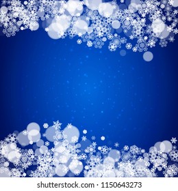 Snowflake border for Christmas and New Year celebration. Holiday snowflake border on blue background with sparkles. For banners, gift coupons, vouchers, ads, party events. Falling frosty snow.