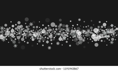 Snowflake border for Christmas and New Year holidays. Horizontal snowflake border on black background. For banners, gift coupons, vouchers, ads, party events. Falling frosty snow.