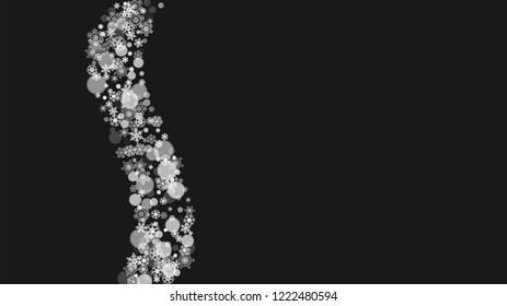 Snowflake border for Christmas and New Year holidays. Horizontal snowflake border on black background. For banners, gift coupons, vouchers, ads, party events. Falling frosty snow.