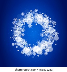 Snowflake border for Christmas and New Year celebration. Holiday snowflake border on blue background with sparkles. For banners, gift coupons, vouchers, ads, party events. Falling frosty snow.