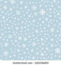 Snowflake doodle seamless pattern. Snow on blue background. Merry Christmas holiday, Happy New Year celebration Vector illustration
