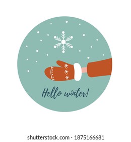 The snowflake falls on the mitten. New year card. Hello winter.