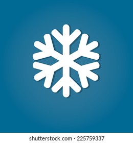 Icono plano de copo de nieve sobre fondo azul