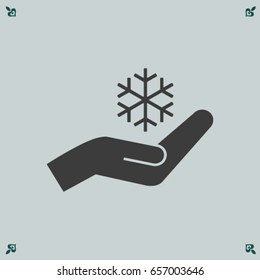 Snowflake and hand icon