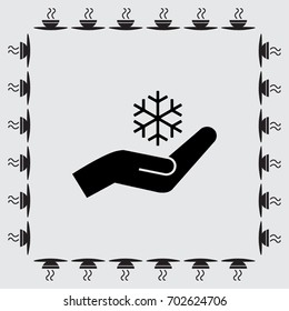 Snowflake and hand icon