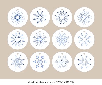 Snowflake hang tag printable. 12 unique snowflake designs on round tags. Eash tag is 2x2inch, when printed on 8.5x11" or A4 size. Use as gift tags or hang tags and write your message on the back.