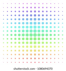 Snowflake icon spectrum halftone pattern. Vector snowflake symbols organized into halftone grid with vertical rainbow colors gradient. Designed for backgrounds, covers and abstract effects.