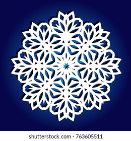 Snowflake for laser cutting. Vector silhouette on blue background. Lacy ornament.