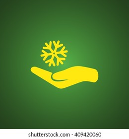 Snowflake on hand icon