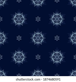 Snowflake seamless vector pattern on a blue background.