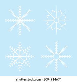 Snowflake set with four white snowflakes on light or baby blue background. Four different shapes of snowflakes for designs, invitations, greeting cards, postcards, decoration.
