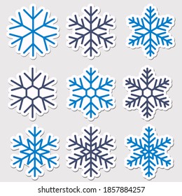 Snowflake stickers. Set of vector illustrations. Christmas decoration templates for holiday design. Simple classic snowflake shapes to decorate posters, flyers or websites. Winter design elements.