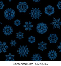 Snowflake vector design in blue colors. Seamless pattern. Snow flakes background.