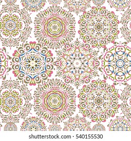 Snowflake vector design in orange, yellow and pink colors.